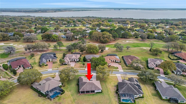 birds eye view of property with a water view