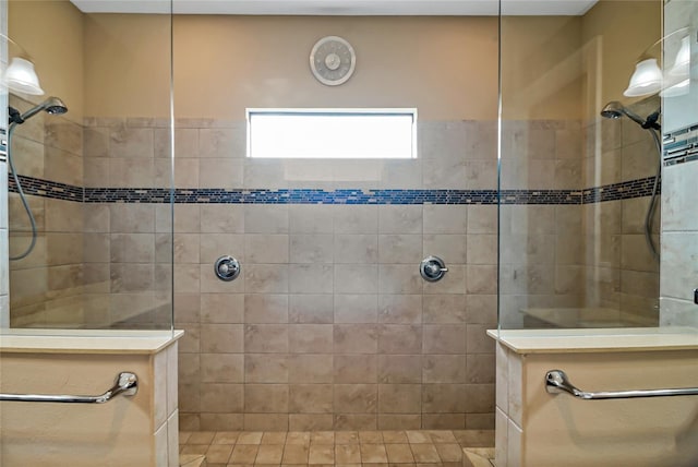 bathroom with tiled shower