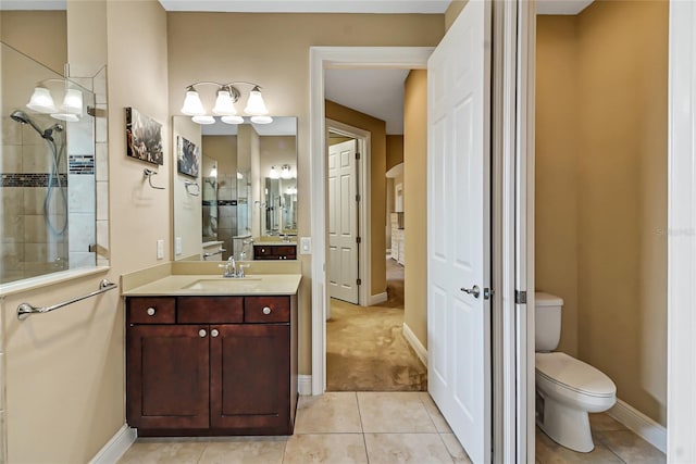 bathroom with tile flooring, oversized vanity, and toilet