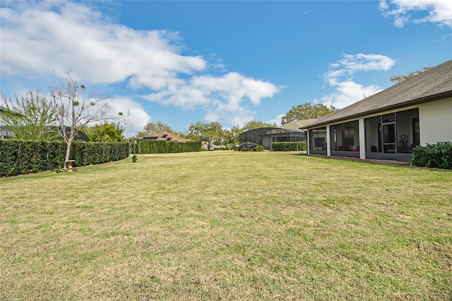 view of yard with a sunroom