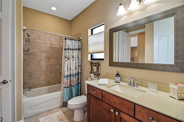 full bathroom with vanity, toilet, tile floors, and shower / bath combo