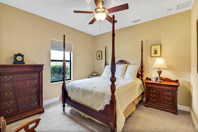 bedroom featuring ceiling fan and light colored carpet