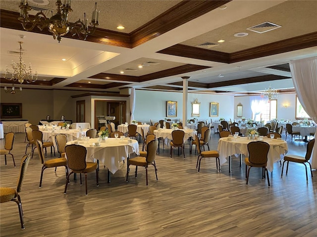 dining space featuring coffered ceiling, hardwood / wood-style floors, a notable chandelier, and beamed ceiling