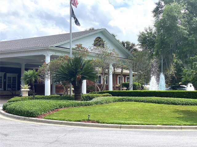 exterior space featuring a front lawn