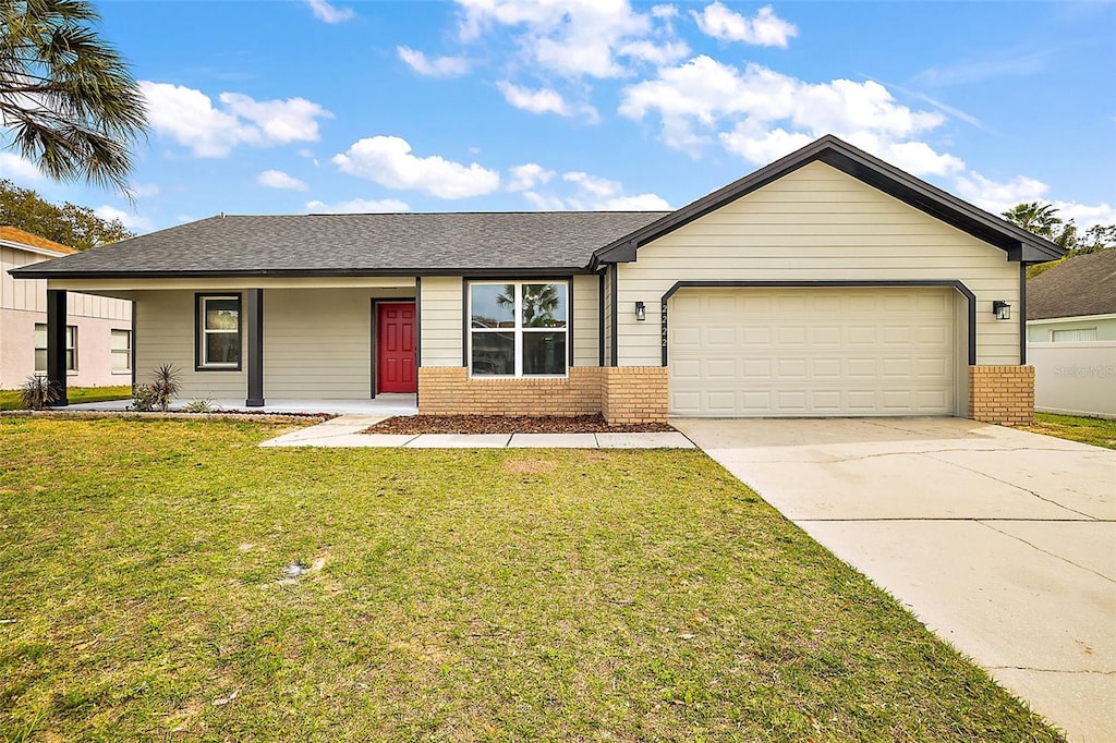 single story home with a front lawn and a garage