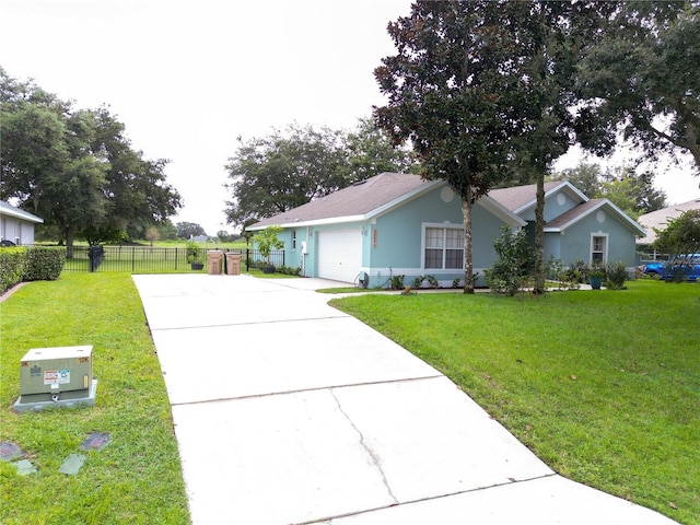 single story home featuring a garage and a front yard