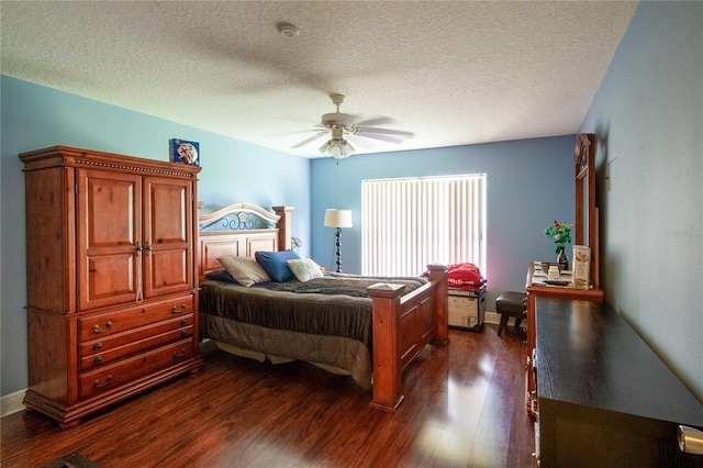 bedroom with dark hardwood / wood-style flooring, ceiling fan, and a textured ceiling