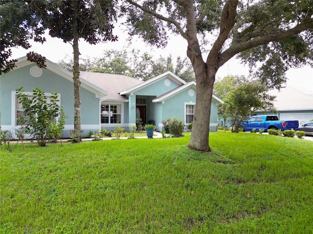 single story home with a front yard