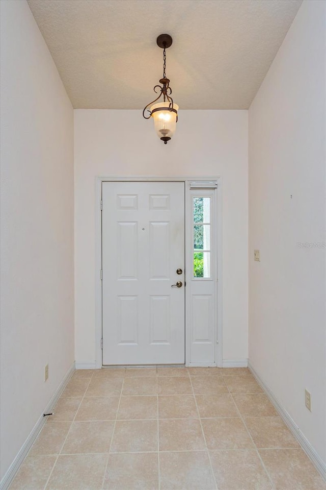 foyer entrance featuring tile patterned floors