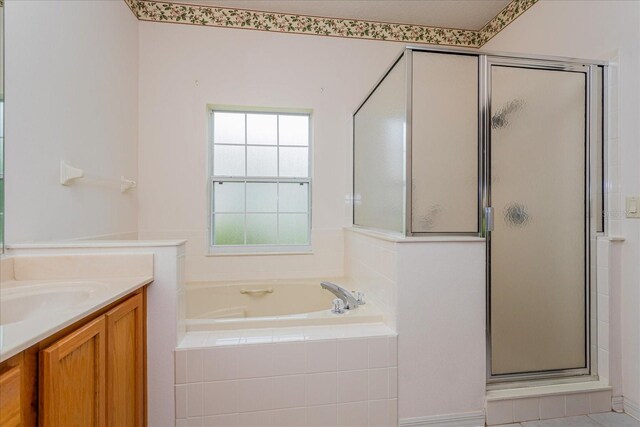 bathroom featuring separate shower and tub and vanity