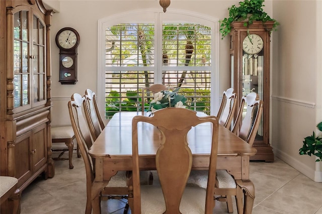 dining space with light tile floors