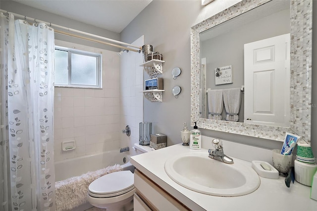 full bathroom featuring shower / bath combo with shower curtain, toilet, and vanity with extensive cabinet space