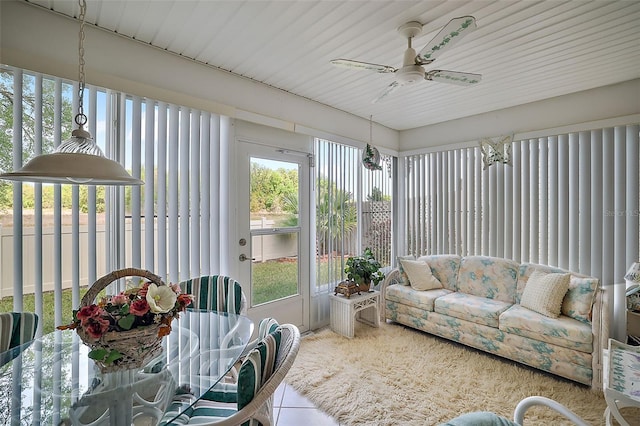 sunroom featuring ceiling fan