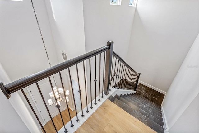 staircase featuring hardwood / wood-style floors