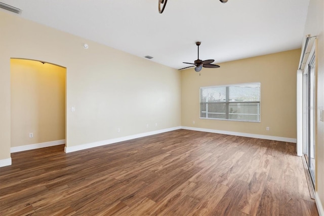 unfurnished room with dark hardwood / wood-style flooring and ceiling fan