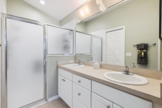 bathroom featuring tile patterned floors, a shower with shower door, lofted ceiling, and vanity