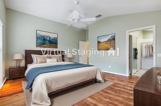 bedroom featuring lofted ceiling, ceiling fan, and hardwood / wood-style floors