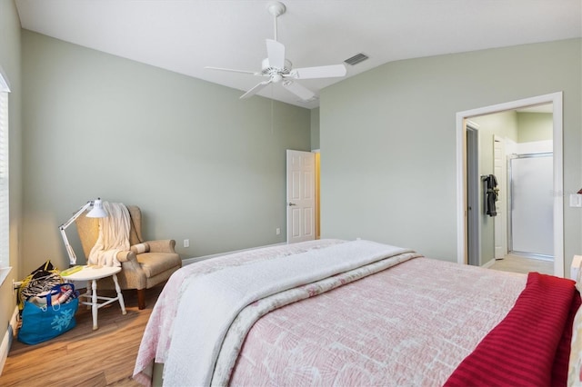 bedroom featuring lofted ceiling, ceiling fan, and light hardwood / wood-style flooring