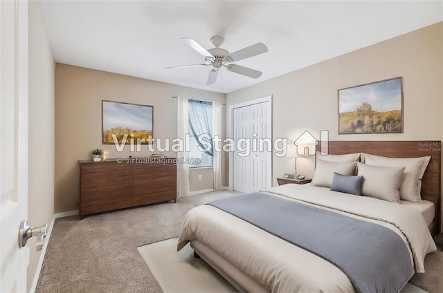 bedroom with a closet, ceiling fan, and light colored carpet