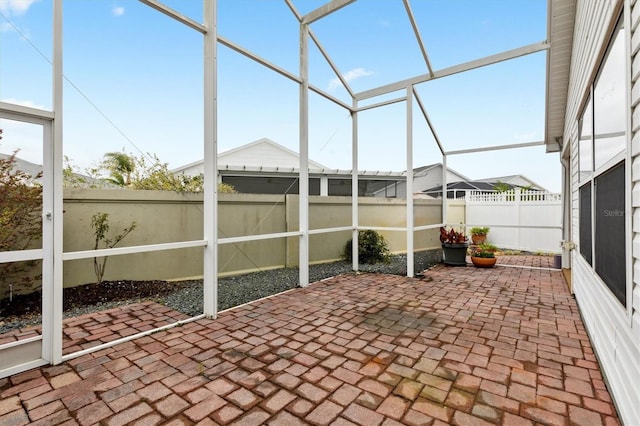 view of patio / terrace with a lanai