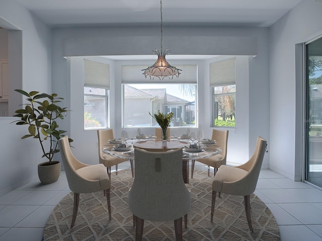 dining space with light tile floors and a wealth of natural light