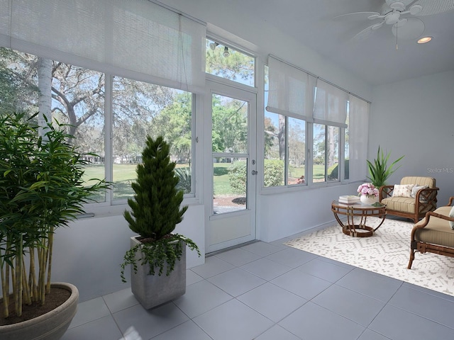 sunroom with ceiling fan and a wealth of natural light