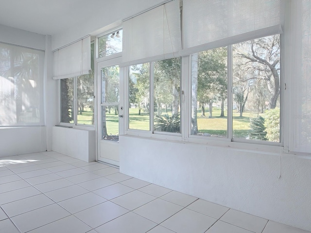 unfurnished sunroom featuring plenty of natural light