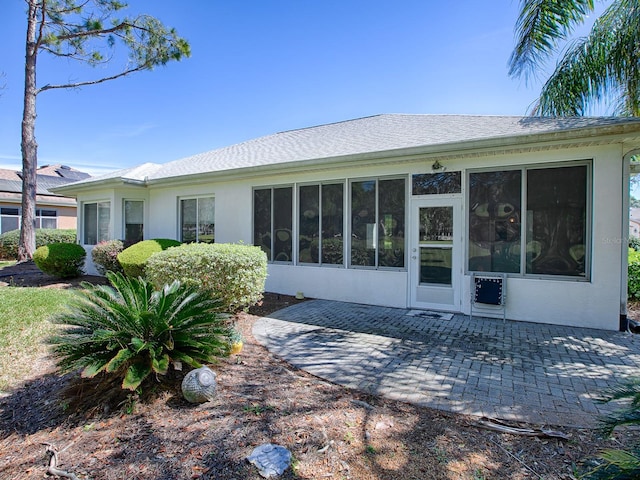 rear view of property featuring a patio area