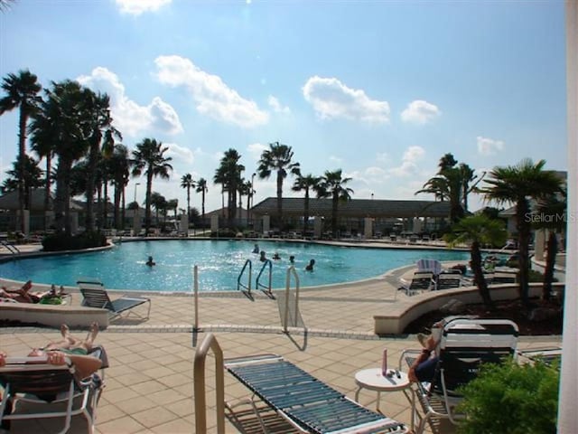 view of swimming pool featuring a patio area