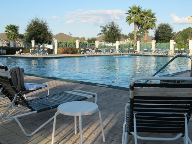 view of swimming pool with a patio area