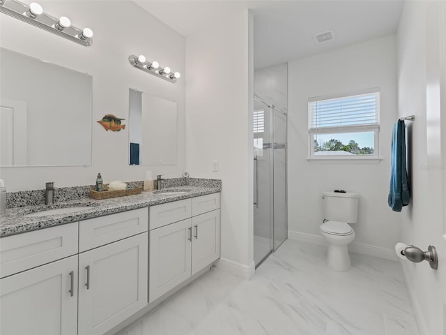 bathroom featuring an enclosed shower, toilet, dual bowl vanity, and tile flooring