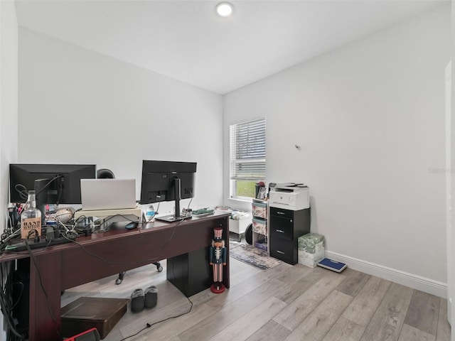 office space with light wood-type flooring