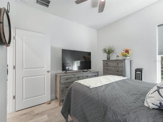 bedroom with ceiling fan and light wood-type flooring