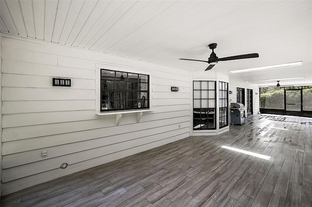 wooden deck featuring ceiling fan and grilling area