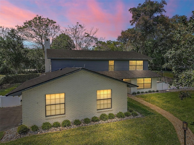 view of front of property with a yard