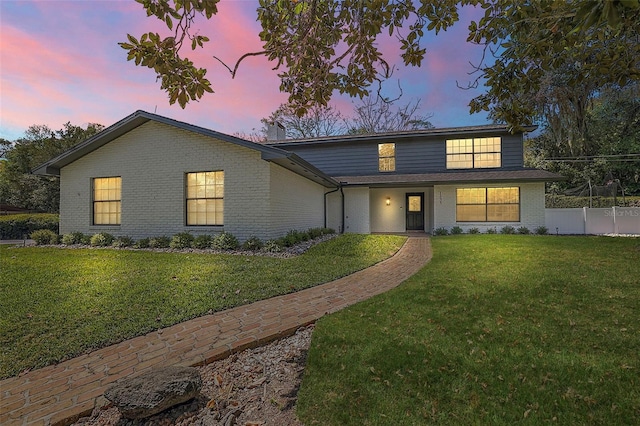 view of front of home featuring a lawn