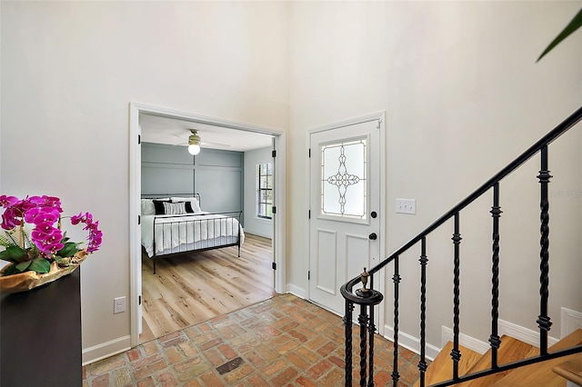 entrance foyer with ceiling fan