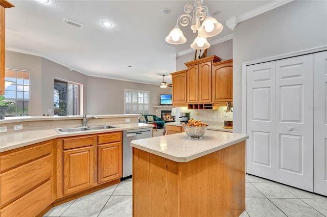 kitchen with ceiling fan with notable chandelier, crown molding, a center island, stainless steel dishwasher, and sink