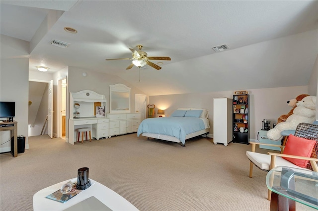 bedroom featuring lofted ceiling, ceiling fan, and light colored carpet