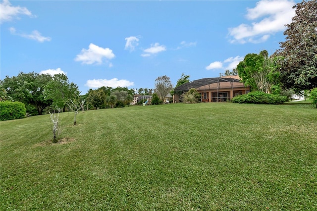 view of yard featuring a lanai