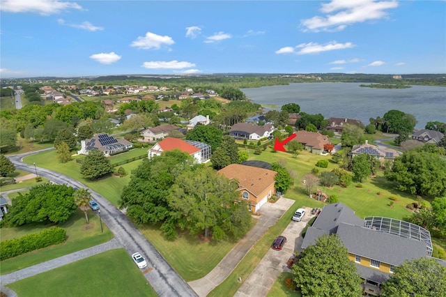 birds eye view of property with a water view