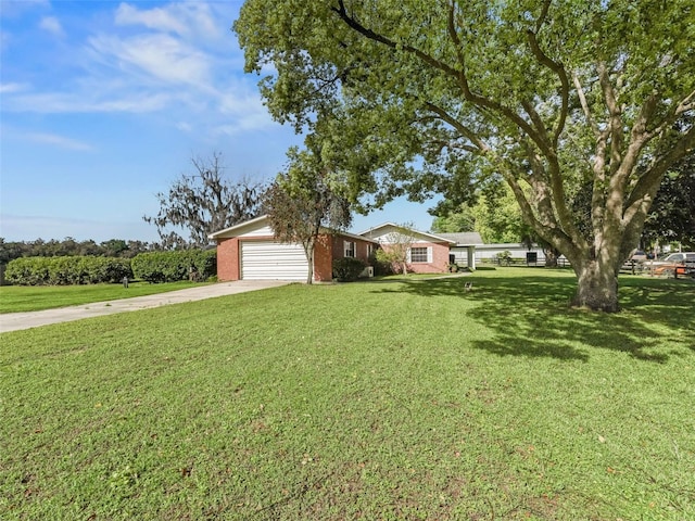 ranch-style house with a front yard and a garage