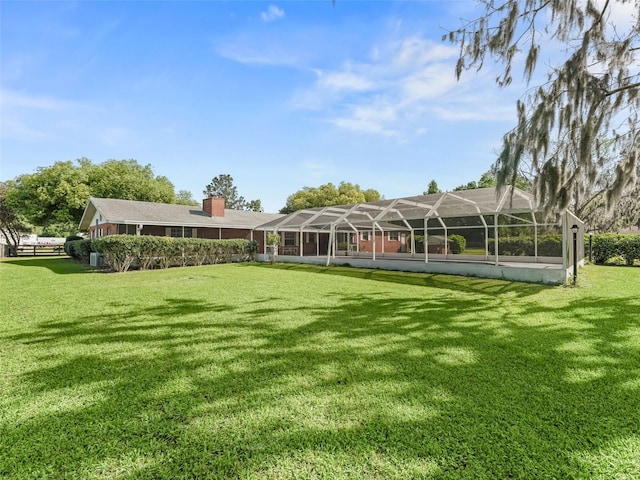 view of yard with a lanai