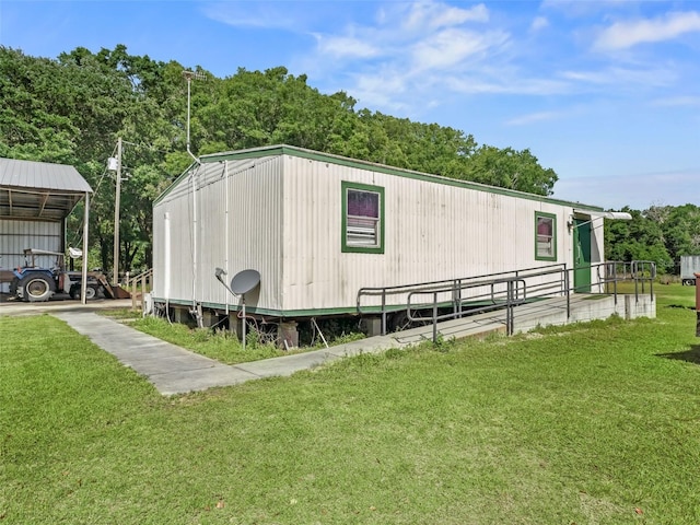 view of shed / structure with a yard