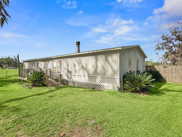 view of property exterior with a yard