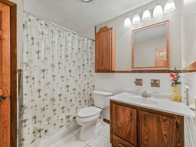 bathroom featuring toilet, a textured ceiling, vanity, tasteful backsplash, and tile floors