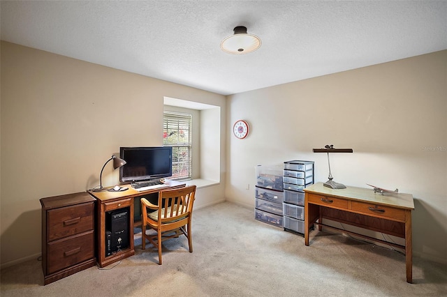 office featuring a textured ceiling and light carpet