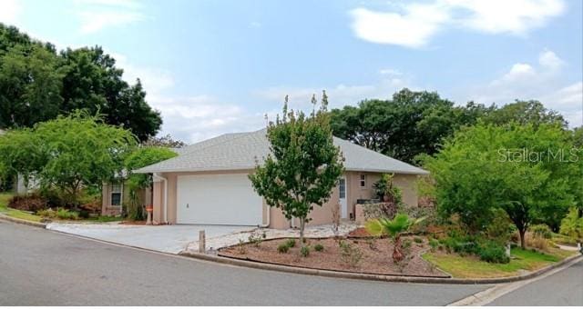 ranch-style home with a garage