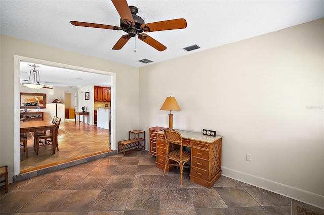 home office featuring ceiling fan, visible vents, and baseboards