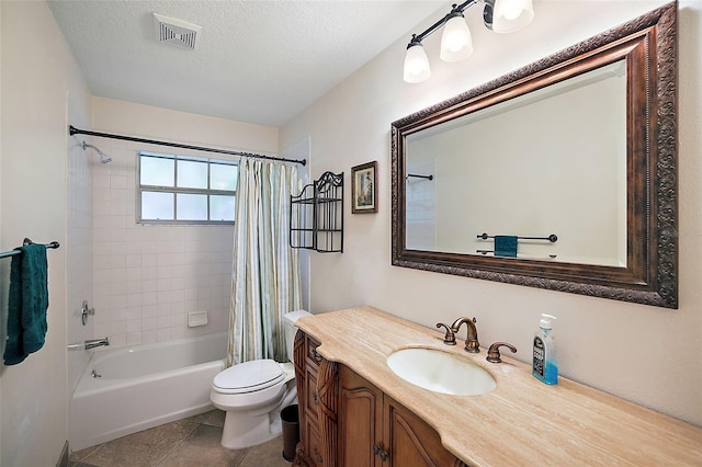 full bathroom featuring visible vents, toilet, a textured ceiling, vanity, and tile patterned flooring